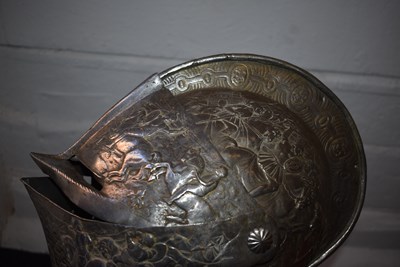 Lot 388 - AN EMBOSSED CLOSE HELMET IN THE EARLY 17TH CENTURY MANNER