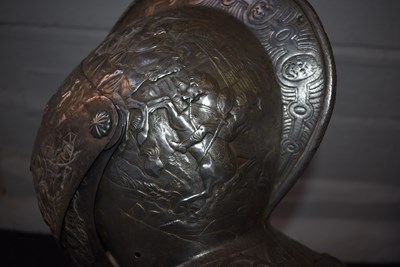 Lot 388 - AN EMBOSSED CLOSE HELMET IN THE EARLY 17TH CENTURY MANNER