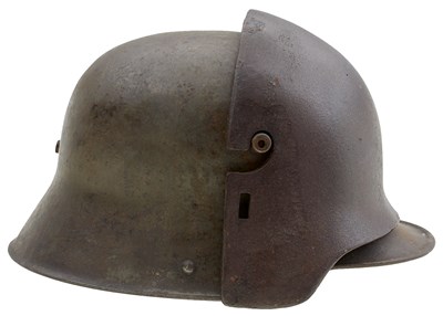 Lot 746 - A FIRST WAR GERMAN M1916 HELMET AND ARMOURED FOREHEAD PLATE