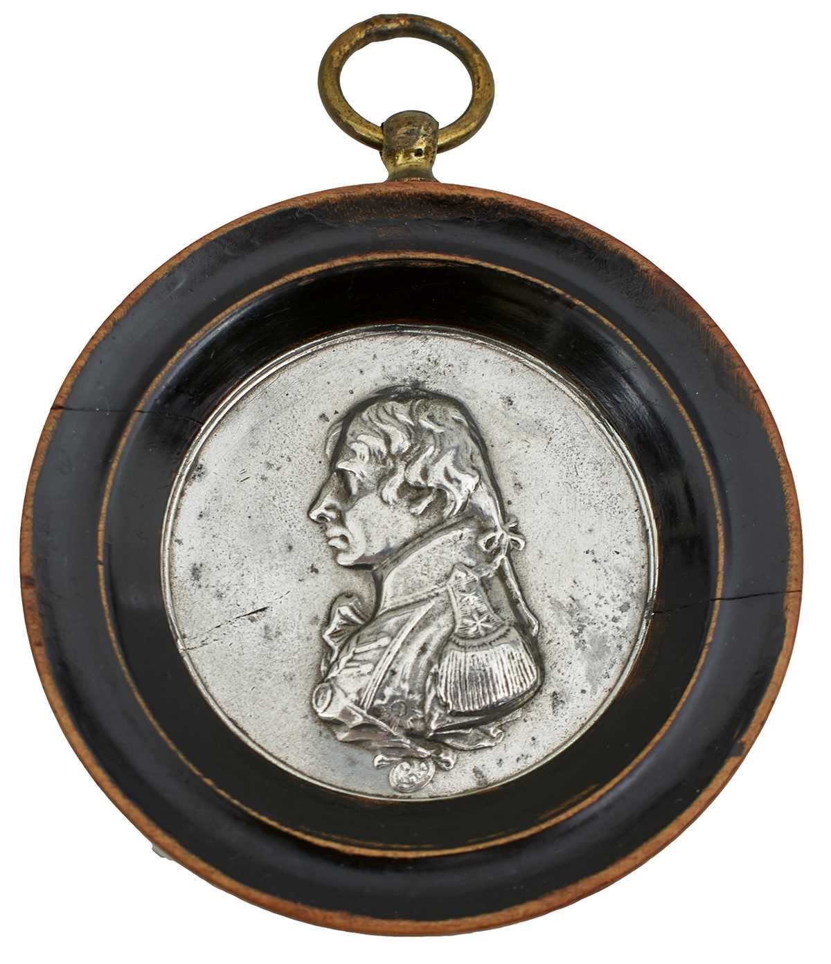 Lot 117 - A WHITE METAL NELSON MEDALLION