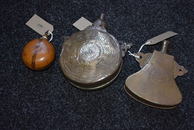 Lot 527 - A CONTINENTAL SEED FORM CIRCULAR WOODEN POWDER FLASK