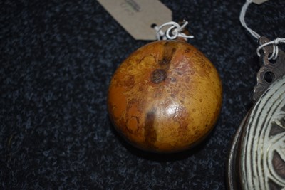 Lot 527 - A CONTINENTAL SEED FORM CIRCULAR WOODEN POWDER FLASK