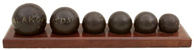 Lot 440 - A DISPLAY OF SIX CRIMEAN WAR CANNON BALLS AND SHRAPNEL BALLS