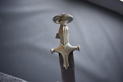 Lot 45 - A 19TH CENTURY WHITE METAL HILTED TULWAR