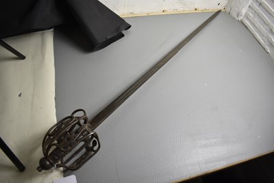 Lot AN 18TH CENTURY BASKET HILTED BACK SWORD