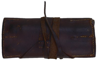 Lot 420 - A LEATHER FLINT AND TOOL ROLL