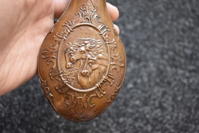 Lot 443 - A PHARAOH'S HORSES EMBOSSED POWDER FLASK
