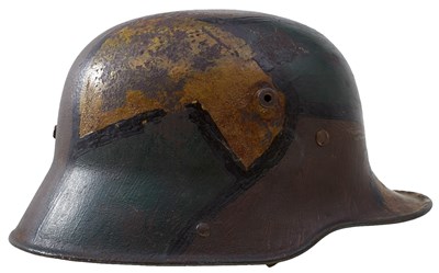 Lot 542 - A GERMAN WWI CAMOUFLAGE STEEL HELMET