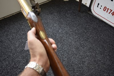 Lot 694 - A FLINTLOCK BRASS BARRELLED BLUNDERBUSS