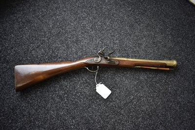 Lot 694 - A FLINTLOCK BRASS BARRELLED BLUNDERBUSS