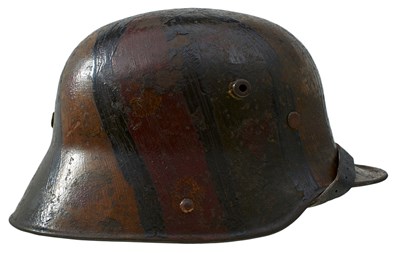 Lot 484 - A FIRST WORLD WAR GERMAN CAMOUFLAGED HELMET