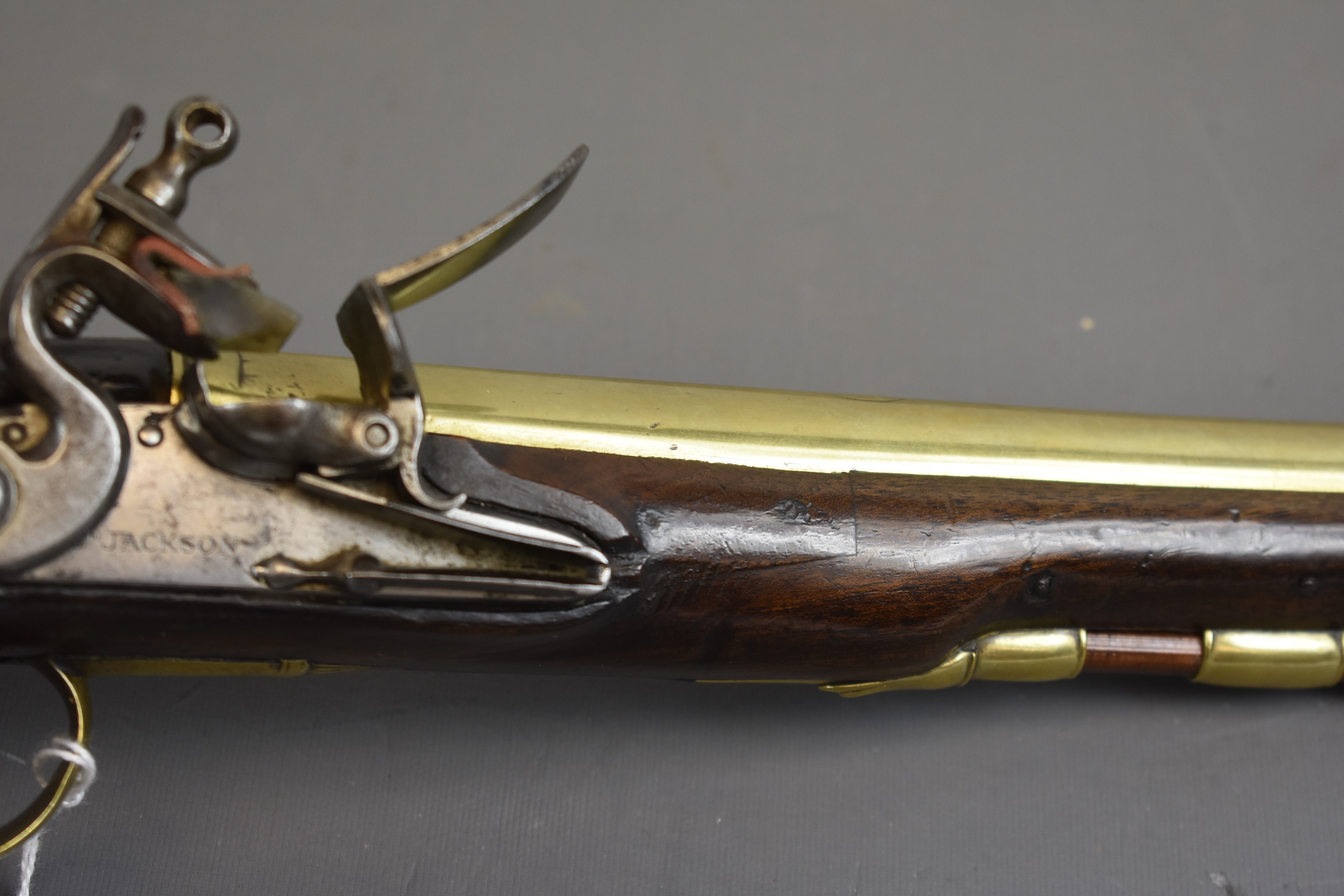 Lot 256 - AN 18-BORE FLINTLOCK BRASS BARRELLED