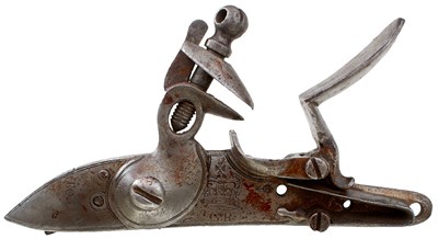 Lot A BROWN BESS LOCK AND A BOX OF LOCK PARTS