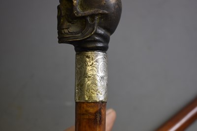 Lot 930 - A MEMENTO MORI SWORD STICK