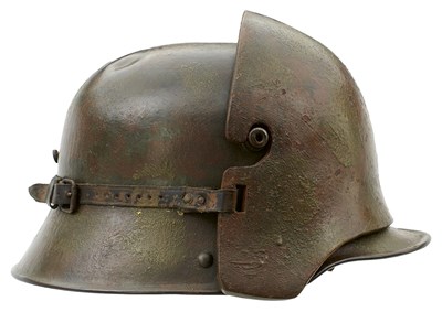 Lot 773 - AN IMPERIAL GERMAN MODEL 1916 STEEL HELMET WITH AROURED FOREHEAD PLATE