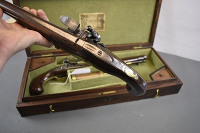 Lot 229 - A CASED PAIR OF 10-BORE FLINTLOCK LONG BARRELLED DUELLING OR OFFICER'S PISTOLS BY PARKER OF LONDON